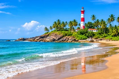 Kovalam Beach with the red and white Vizhinjam lighthouse, Trivandrum